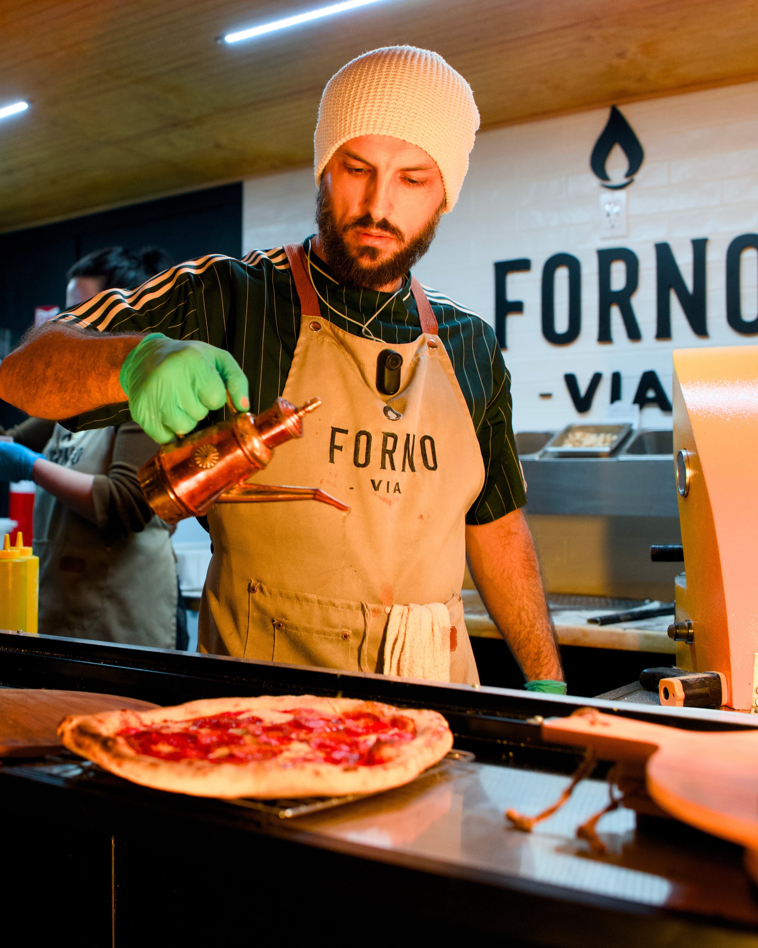The Forno Via mobile pizza trailer set up and ready to serve at an event venue