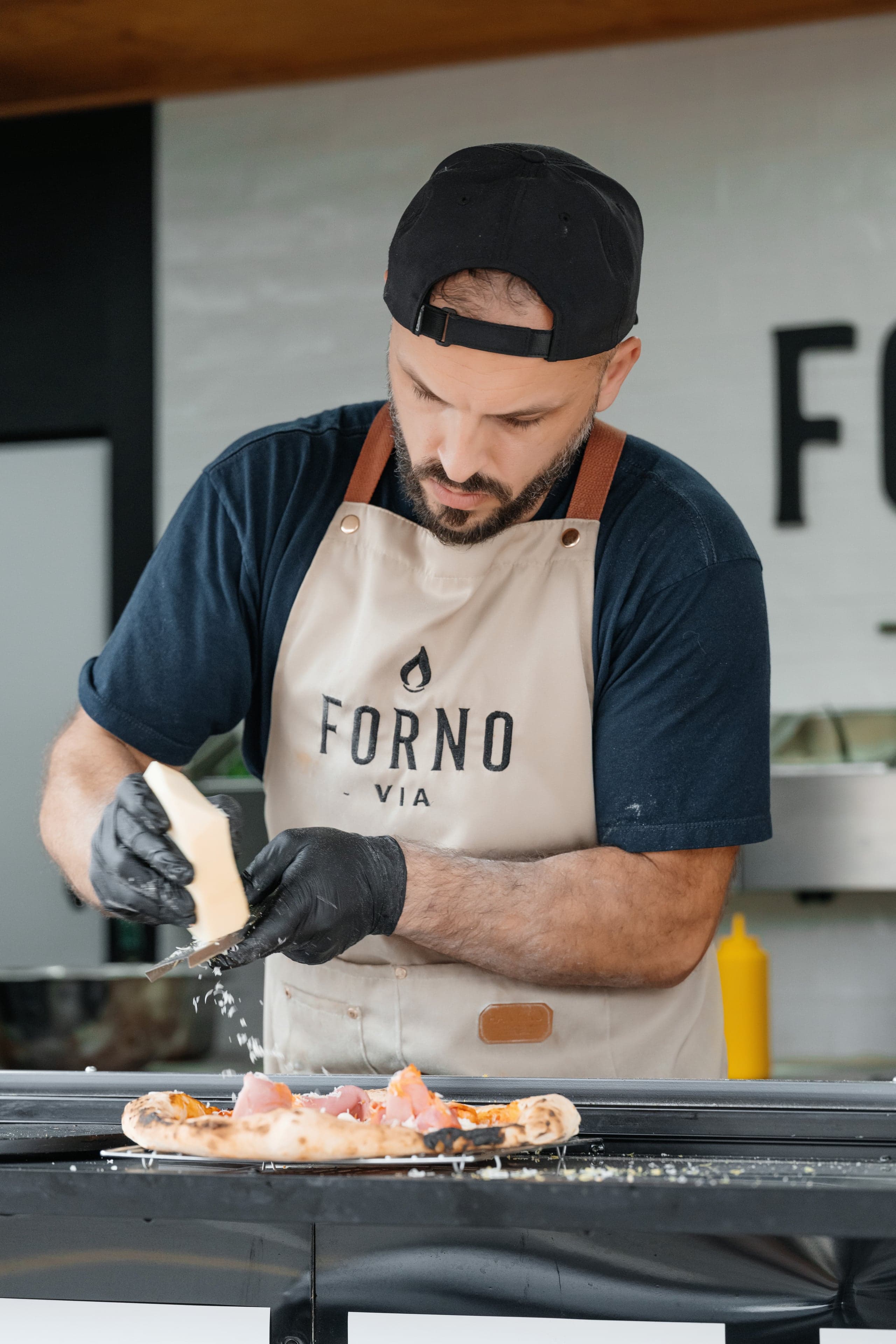Forno Via branded catering trailer parked at an outdoor event location