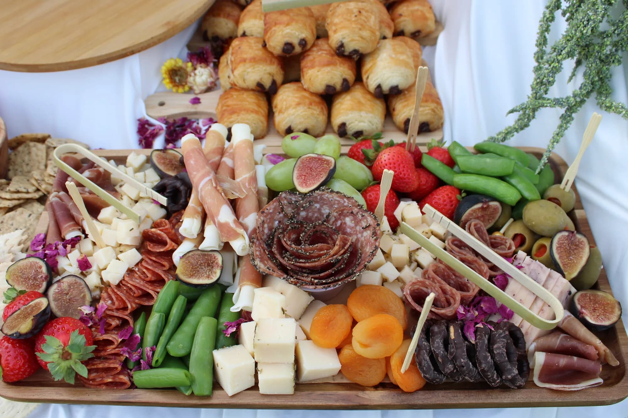 Abundant Forno Via grazing table with cheeses, charcuterie, fruit, breads, and vegetables